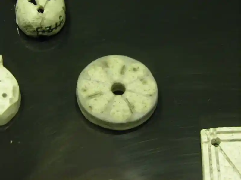 Solar disc engraved on an ornament